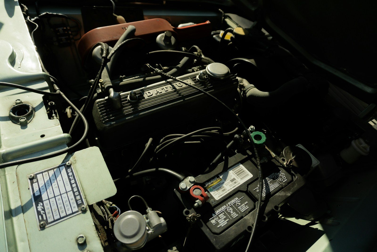 Car battery installed beside the engine
