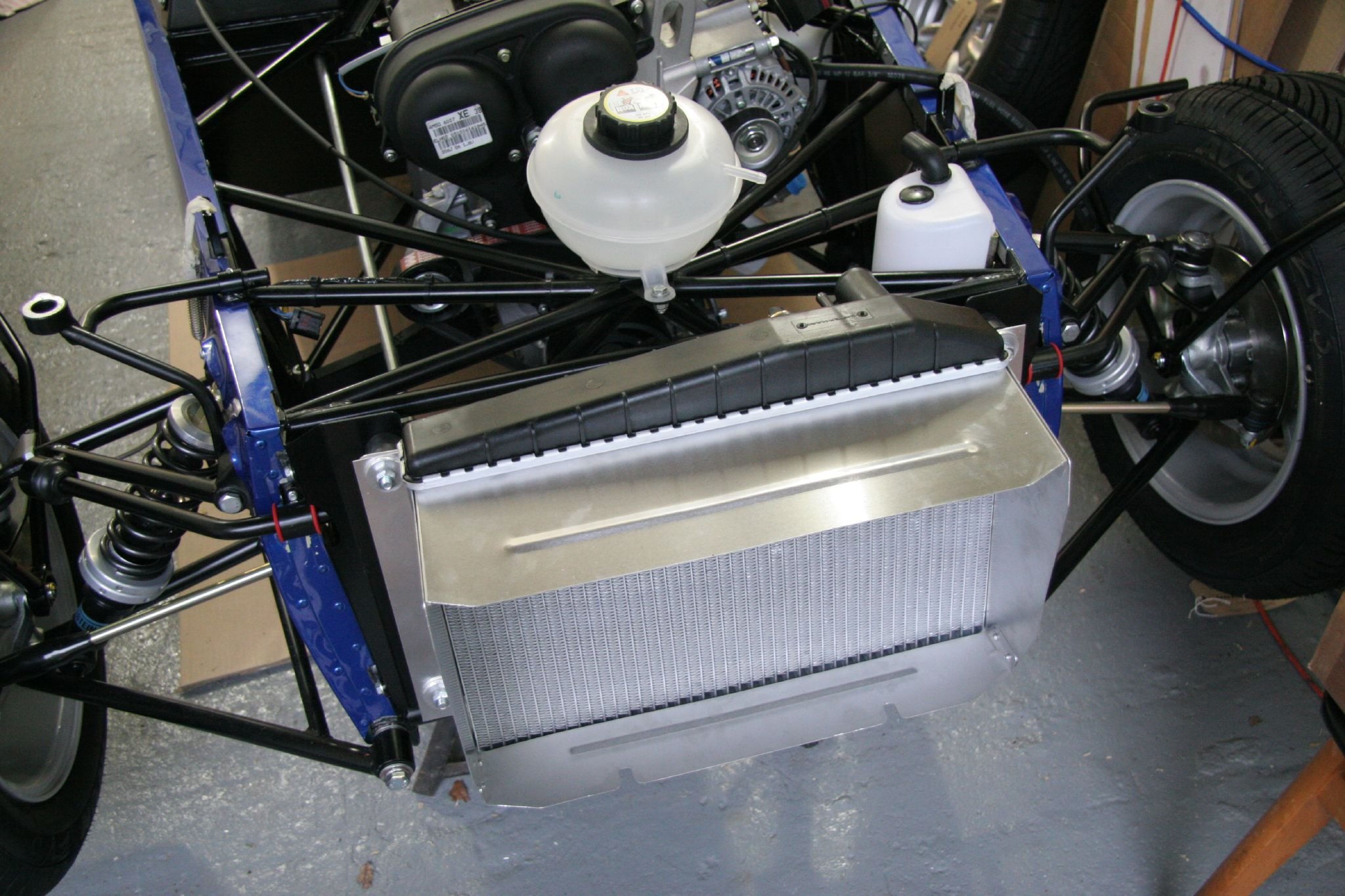 Coolant expansion tank and radiator during a Caterham vehicle build